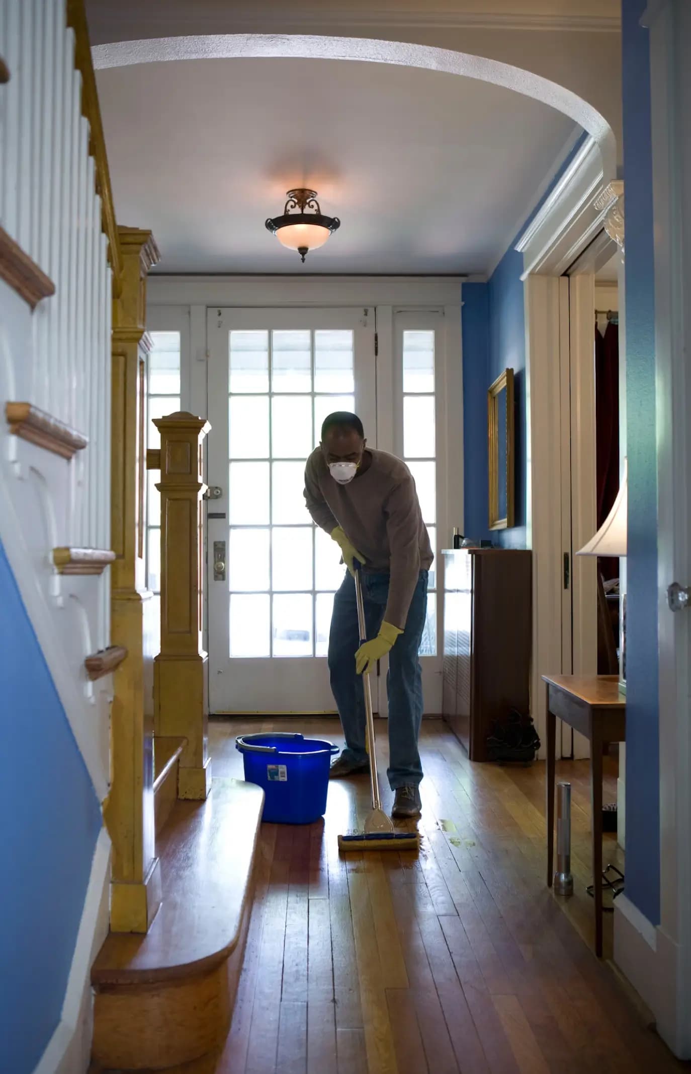 Person cleaning hallway